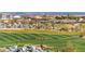 Scenic golf course view showcasing manicured greens, desert vegetation, and clear skies at 2701 N Black Rock Rd, Buckeye, AZ 85396