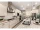 Bright kitchen boasts stainless steel appliances, gas cooktop, granite counters, and a convenient kitchen island at 2701 N Black Rock Rd, Buckeye, AZ 85396