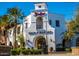 Exterior of Main Street Market with Spanish architecture and palm trees at 2701 N Black Rock Rd, Buckeye, AZ 85396