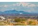 Expansive mountain view featuring desert vegetation and iconic stadium in the distance at 2701 N Black Rock Rd, Buckeye, AZ 85396