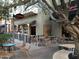 Outdoor patio seating area at a restaurant with tables and chairs at 2701 N Black Rock Rd, Buckeye, AZ 85396