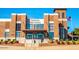 Verado High School features traditional brick design with abundant windows and manicured landscaping at 2701 N Black Rock Rd, Buckeye, AZ 85396