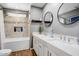 Bright bathroom with double vanity, soaking tub with shower, and modern finishes at 2846 E Lupine Ave, Phoenix, AZ 85028