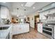 Spacious kitchen with white cabinetry, stainless steel appliances, and views into the living spaces at 2846 E Lupine Ave, Phoenix, AZ 85028