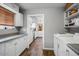 Practical laundry room with storage cabinets and modern washer and dryer units at 2846 E Lupine Ave, Phoenix, AZ 85028