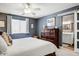 Comfortable bedroom with a ceiling fan, nightstands and an ensuite bathroom at 2846 E Lupine Ave, Phoenix, AZ 85028