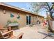 Spacious brick patio featuring a sliding glass door, outdoor seating, and decorative accents, ideal for outdoor living at 2846 E Lupine Ave, Phoenix, AZ 85028