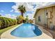 Inviting backyard pool featuring clear blue water and well-maintained landscaping, perfect for relaxation and recreation at 2846 E Lupine Ave, Phoenix, AZ 85028