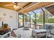 Relaxing sun room with ample natural light, wicker seating, and views of the backyard at 2846 E Lupine Ave, Phoenix, AZ 85028