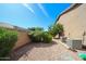 Low-maintenance backyard with gravel landscaping, privacy bushes, and two AC units at 2886 E Hazeltine Way, Chandler, AZ 85249