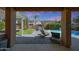 Inviting backyard with a covered patio, pool, fire pit, and lush landscaping, perfect for outdoor enjoyment at 2886 E Hazeltine Way, Chandler, AZ 85249