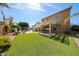 Spacious backyard with an outdoor kitchen, pool, and lush lawn, perfect for enjoying the outdoors at 2886 E Hazeltine Way, Chandler, AZ 85249