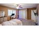 Bright bedroom with neutral tones, carpet, a desk area, and good closet space at 2886 E Hazeltine Way, Chandler, AZ 85249