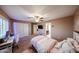 Warm bedroom with a cozy bed, desk area, and good closet space, bathed in natural light at 2886 E Hazeltine Way, Chandler, AZ 85249