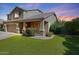 Well-maintained two-story home with a three-car garage, lush lawn, and welcoming front entrance at 2886 E Hazeltine Way, Chandler, AZ 85249