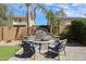 Custom outdoor stone fire pit with seating and pavers in a landscaped backyard at 2886 E Hazeltine Way, Chandler, AZ 85249