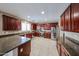 Beautiful kitchen featuring stainless steel appliances, granite counters, and custom cabinetry at 2886 E Hazeltine Way, Chandler, AZ 85249