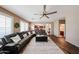 Spacious living room boasts wood-look floors, a sectional sofa, and ample natural light at 2886 E Hazeltine Way, Chandler, AZ 85249
