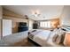 Spacious main bedroom with plush carpeting, large bed, and ample natural light coming through the plantation shutters at 2886 E Hazeltine Way, Chandler, AZ 85249