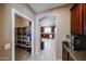 Walk-in pantry adjacent to the kitchen, providing plentiful storage space for food and supplies at 2886 E Hazeltine Way, Chandler, AZ 85249
