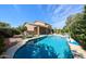 Resort-style pool with outdoor dining, lounge chairs, lush landscaping, and a covered patio at 2886 E Hazeltine Way, Chandler, AZ 85249