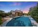Backyard featuring a refreshing pool, landscaped yard, covered patio, and seating area, ideal for outdoor living at 2886 E Hazeltine Way, Chandler, AZ 85249