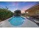Beautiful backyard pool with covered patio and landscaped yard at 2886 E Hazeltine Way, Chandler, AZ 85249