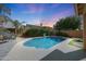Backyard pool with mature landscaping, firepit, and patio area, providing a private outdoor oasis at 2886 E Hazeltine Way, Chandler, AZ 85249
