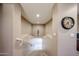 Inviting staircase leads to a bright lower level, featuring a decorative vase and stylish wall clock at 2886 E Hazeltine Way, Chandler, AZ 85249