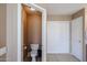 Functional powder room adjacent to a linen closet and a mirrored vanity in the main bathroom at 2886 E Hazeltine Way, Chandler, AZ 85249