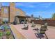 Outdoor space featuring a brick patio, garden planters, and comfortable seating, perfect for entertaining at 2941 E Nisbet Ct, Phoenix, AZ 85032