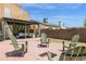 Charming backyard with brick fire pit and Adirondack chairs, perfect for outdoor gatherings and relaxation at 2941 E Nisbet Ct, Phoenix, AZ 85032