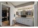 Bathroom features a double vanity with granite countertops and a walk-in closet at 2941 E Nisbet Ct, Phoenix, AZ 85032