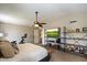 Spacious bedroom with ceiling fan and built-in storage shelving perfect for personalizing at 2941 E Nisbet Ct, Phoenix, AZ 85032