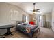 Spacious bedroom with vaulted ceilings, fan, bench, and an abundance of natural light at 2941 E Nisbet Ct, Phoenix, AZ 85032