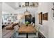 Well-lit dining area with a large rustic table, neutral tones, and unique decorative touches at 2941 E Nisbet Ct, Phoenix, AZ 85032