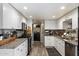 Bright kitchen includes granite countertops, white cabinets, and stainless steel appliances at 2941 E Nisbet Ct, Phoenix, AZ 85032