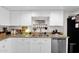 Beautiful kitchen with stainless steel appliances, granite countertops, and white cabinets at 2941 E Nisbet Ct, Phoenix, AZ 85032