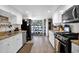 Spacious kitchen featuring stainless steel appliances, granite countertops, and white cabinets at 2941 E Nisbet Ct, Phoenix, AZ 85032