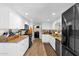Bright kitchen with white cabinets, granite countertops, stainless steel appliances, and wood-look flooring at 2941 E Nisbet Ct, Phoenix, AZ 85032