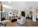 Open-concept living room with fireplace and dining area, with stylish decor and comfortable seating at 2941 E Nisbet Ct, Phoenix, AZ 85032