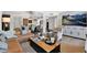 Bright living room boasts stylish decor, wood floors, and an open floor plan flowing into the dining area at 2941 E Nisbet Ct, Phoenix, AZ 85032