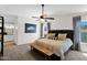 Serene main bedroom features a plush bed, neutral decor, and a glimpse of an ensuite bathroom at 2941 E Nisbet Ct, Phoenix, AZ 85032