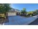 Inviting home with manicured lawn, mature trees, and a two-car garage at 29740 N 121St Ave, Peoria, AZ 85383