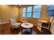 Cozy living room seating area with natural light, chairs, and view to the outside at 29740 N 121St Ave, Peoria, AZ 85383