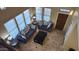 Bright living room with high ceilings, large windows, and comfortable seating at 29740 N 121St Ave, Peoria, AZ 85383