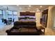 Open-concept living space featuring a modern kitchen and a cozy leather sofa at 29740 N 121St Ave, Peoria, AZ 85383