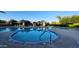 Community pool with shaded seating area and desert landscaping at 29740 N 121St Ave, Peoria, AZ 85383