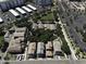 A bird's eye view capturing a neighborhood with mature landscaping, modern apartments, and parking facilities at 3065 E Tamarisk St, Gilbert, AZ 85296