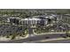 Wide angle shot of the exterior of the apartment complex featuring a large parking lot and easy access to the highway at 3065 E Tamarisk St, Gilbert, AZ 85296